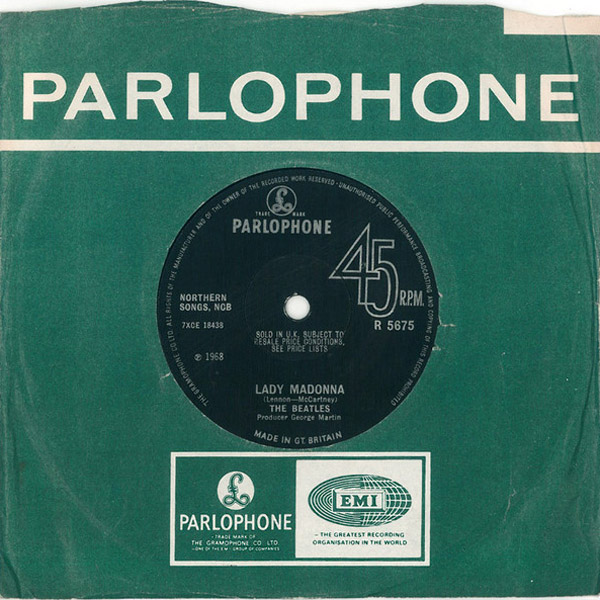 Cover and 45 Rpm of the Single WOMAN by John Lennon from 1981. he